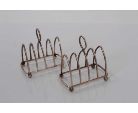Pair of George V silver four division toast racks (Birmingham 1923 / Chester 1924), maker Haseler &amp; Bill, all at 2ozs (2)