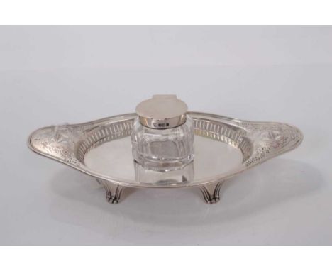 Edwardian silver inkstand with pierced and engraved decoration and central cut glass inkwell with silver mount, (Sheffield 19