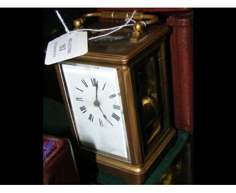 A 13cm high brass cased carriage clock with leather travelling case CONDITION REPORTPlease see further images; not ticking; b