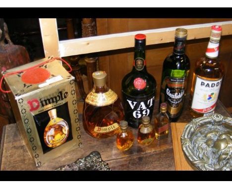 An unopened Dimple Scotch Whisky - boxed, together with other spirits 