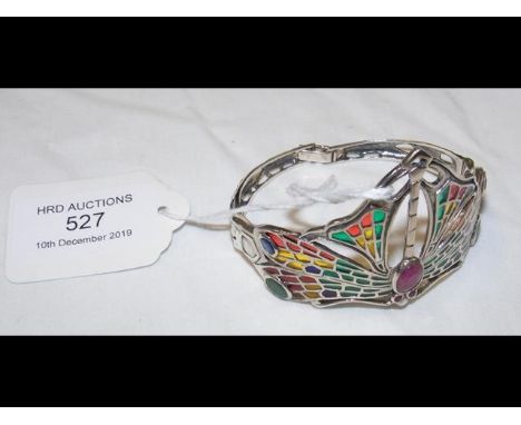 A silver 'dragonfly' bangle set with rubies, emeralds and sapphires CONDITION REPORTgood condition 23g