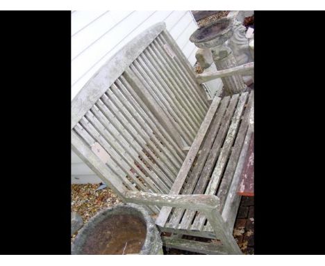 A high back teak garden bench 