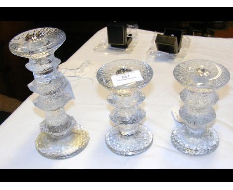 A Timo Sarpaneva Iittala glass candlestick - signed, together with  a shorter pair of candlesticks - both signed 