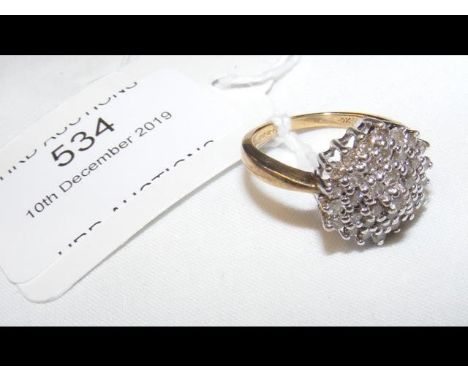 A diamond cluster ring in gold setting CONDITION REPORTsize OMarked 9k