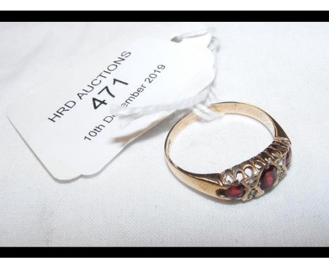 A three stone ring in gold setting 