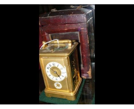 A French brass cased repeater carriage clock with alarm - the face marked Leroy &amp; Co., Paris - 13cm high - with travellin