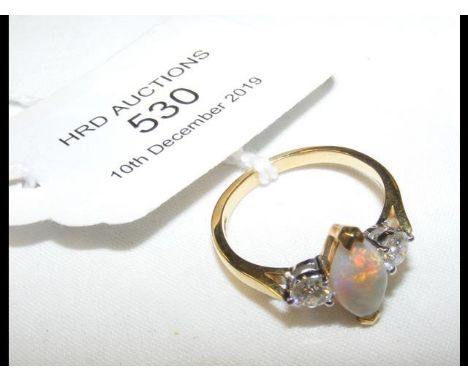 An opal and diamond ring in 18ct gold setting CONDITION REPORTRing size P