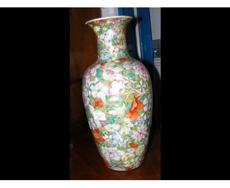 An oriental vase with floral decoration and mark to base - 44cm high CONDITION REPORTHairline crack to upper body; base drill