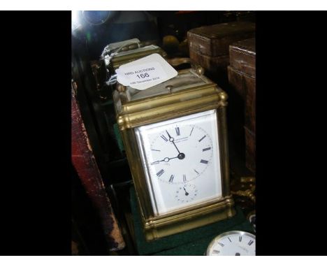 A brass cased repeater carriage clock with alarm - 13cm high - the enamel face marked Clattenberger, Regent Street CONDITION 