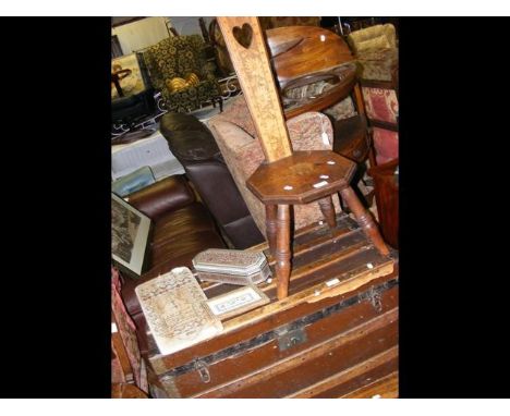 An antique storage trunk, together with a spinning stool 