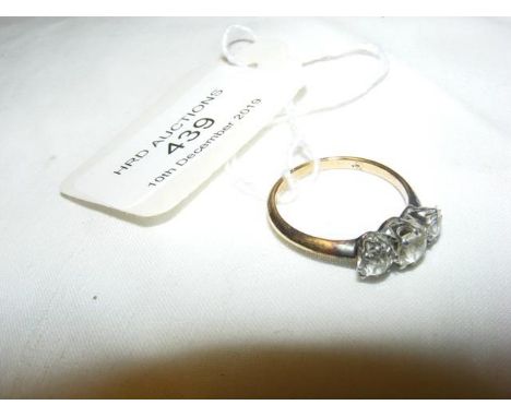 A three stone diamond ring in 18ct gold setting 