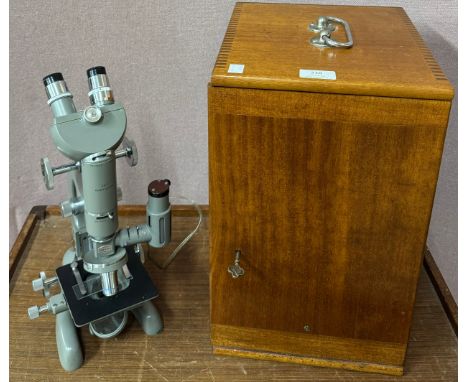 A cased Beck microscope, specimen slides, etc.