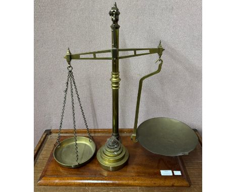 A set of Victorian mahogany and brass weighing scales and a set of graduated brass weights 