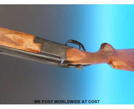 A Browning B26 12 bore double barrelled over and under shotgun with 28 inch barrels, 2.75 inch chambers, choked half and full