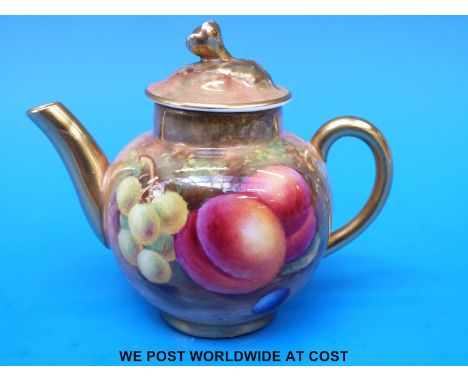 A Royal Worcester painted fruit miniature teapot signed A Shuck, date 1942 (8cm tall)