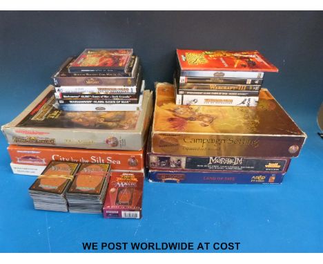 A collection of Warhammer role playing games and playing cards together with a quantity of Warhammer PC games