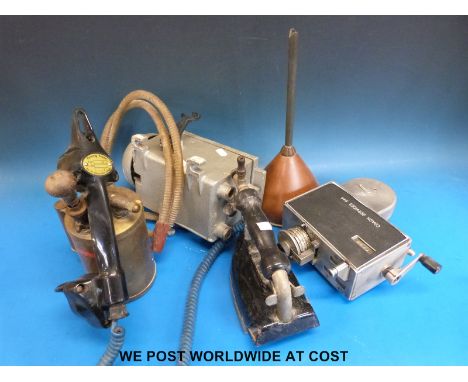 A coach services ticket machine, iron, vintage telephone, funnel etc