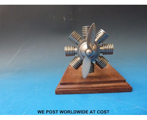 A radial aero engine vintage car mascot with moving propeller length 14cm, diameter approximately 9cm
