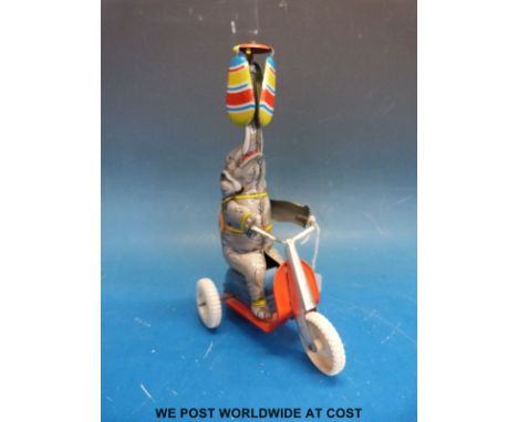 Fleischmann US Zone Germany clockwork tinplate elephant balancing a helicopter type spinning top above its head