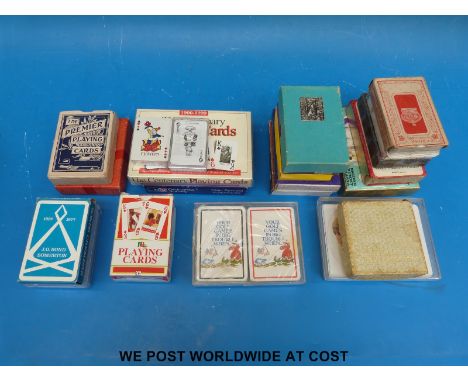 A collection of vintage playing cards including Animal Families