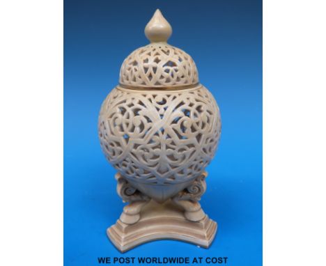 A Royal Worcester lidded ivory pot pourri on tripod legs, shape no G565 (16cm tall)