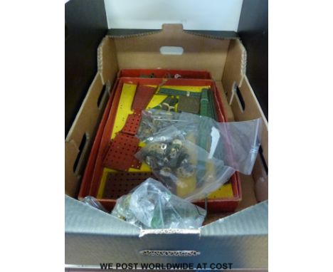 A quantity of Meccano to include a 1948 No 7 set, a bag of Meccano pieces, an instruction booklet and a clockwork motor, toge