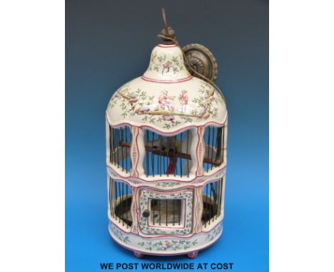 A ceramic hanging light in the form of a bird cage with chinoiserie decoration, probably French (35cm tall)