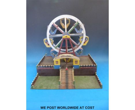 A scratch built WWII prisoner of war clockwork wooden fairground ferris wheel, script in pen verso 'P Arnold Kuehn, P R Boern