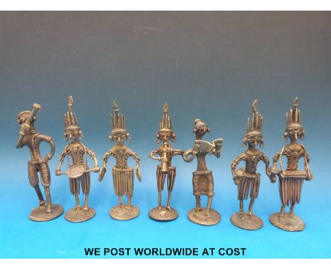 Seven Ashanti tribe gold weights all in the form of figures playing musical instruments (15cm tall)