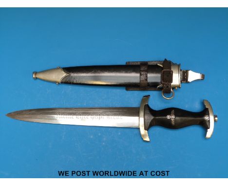 A WWII Nazi German SS dagger in scabbard with vertical hanger, marked to blade with rare maker's stamp E.P & S Solingen and e