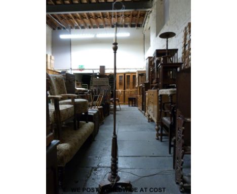 A standard lamp with carved and reeded triform base