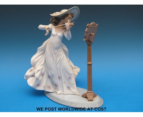 A Lladro figurine of a girl playing a violin (22cm tall)