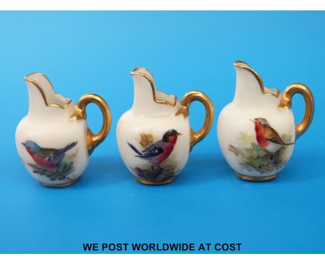 Three Royal Worcester minature flatback jugs, each hand decorated with birds and all with puce marks (3.6cm tall)