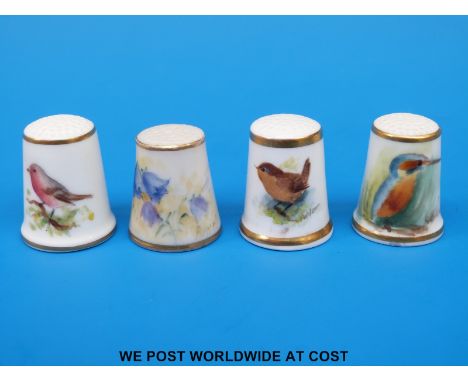 Four signed Royal Worcester thimbles, three hand decorated with birds and one with campanula, all with black stamps (tallest 