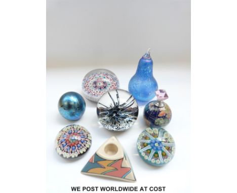 An English magnum paperweight with star shaped red, white and blue canes (10cm diameter) together with seven other paperweigh