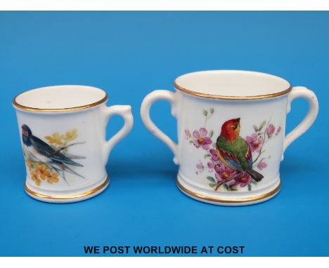 A Royal Worcester miniature loving cup and a mug, both hand decorated with birds and with puce marks (tallest 4cm)