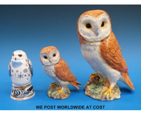 A pair of Beswick owls and a Royal Worcester Snowy owl