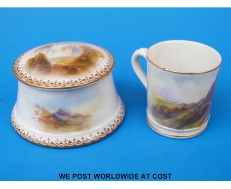 A Royal Worcester circular lidded box, the lid hand painted with a castle in landscape by Rushton, date 1911 (7cm diameter) t
