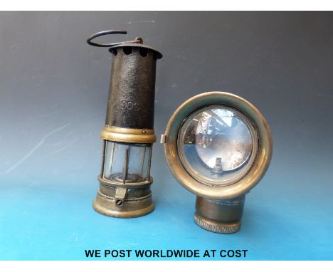 A Miller motorcycle acetylene lamp approximately 16cm tall, together with a miner's lamp stamped 22/10/1908, approximately 24