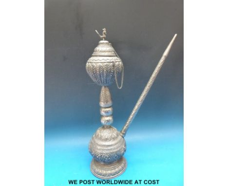 An embossed hookah pipe, possibly white metal (32cm tall)