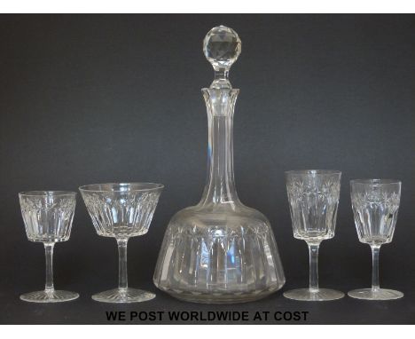 A suite of cut glass ware comprising two decanters, 9 wine glasses, 9 small wine glasses, 7 port glasses and 7 cocktail glass