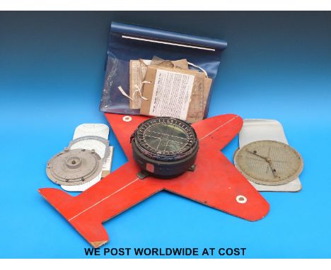 An H Hughes & Son Ltd Mk X aircraft compass mounted on a cut out of an aircraft together with a quantity of course, distance,