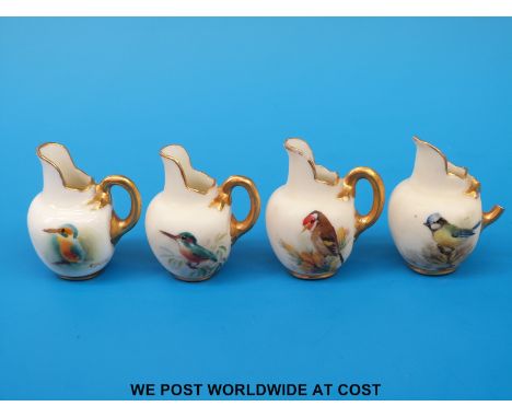Four Royal Worcester miniature flatback jugs hand decorated with birds, two signed (3.6cm tall)