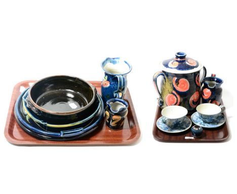 A collection of Isabel K-J Denyer glazed studio pottery (with KK mark) including twin handled pot and cover, plates, jugs, te