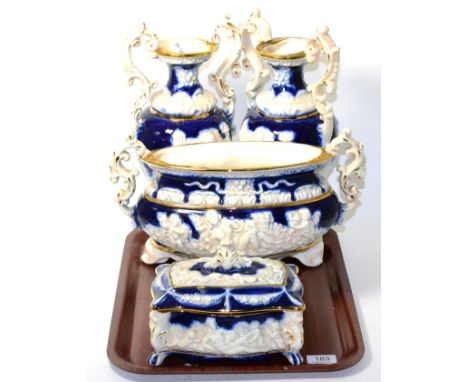 Four piece blue and gilt ceramic vase set 