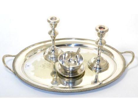 A silver plated tray, a pair of dwarf candlesticks and a plated sugar and basin 