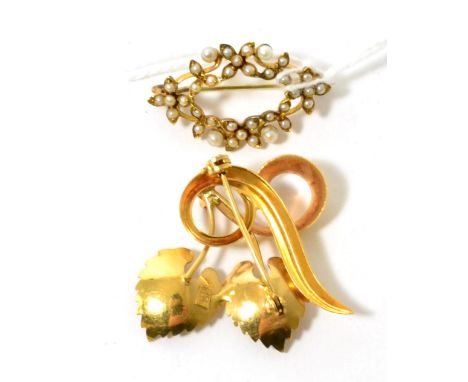 A ruby set spray brooch, stamped '750' and a seed pearl set brooch (2)Ruby brooch 5g, pearl brooch 3.7g