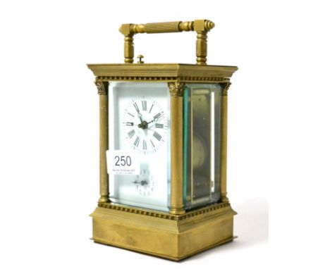 A reproduction brass striking and repeating alarm centre seconds carriage clock 