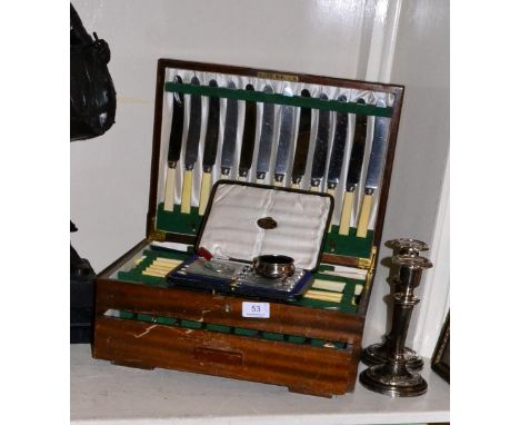 Silver handled knives, silver cigarette case, pair of candlesticks and a canteen of plated cutlery 3ozt