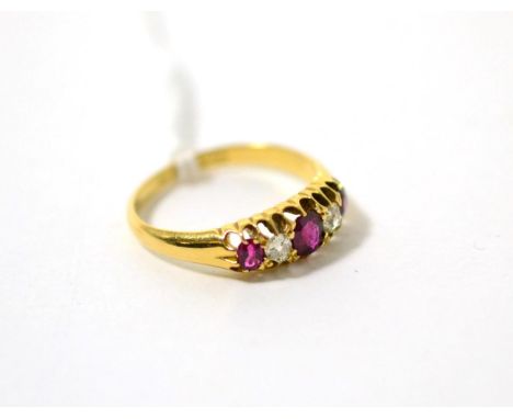 An 18ct gold ruby and diamond ring, total estimated diamond weight 0.20 carat approximately, finger size M1/22.6 grams 